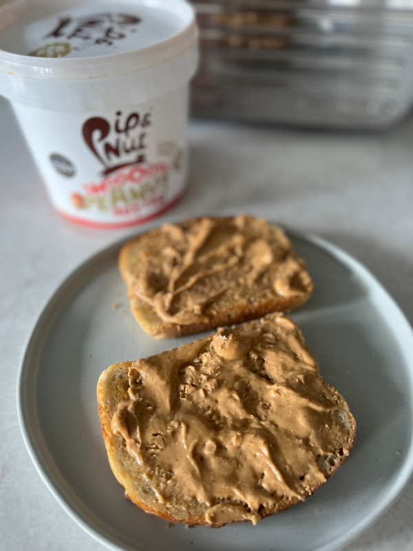 Photo of Pip & Nut smooth peanut butter spread on toast